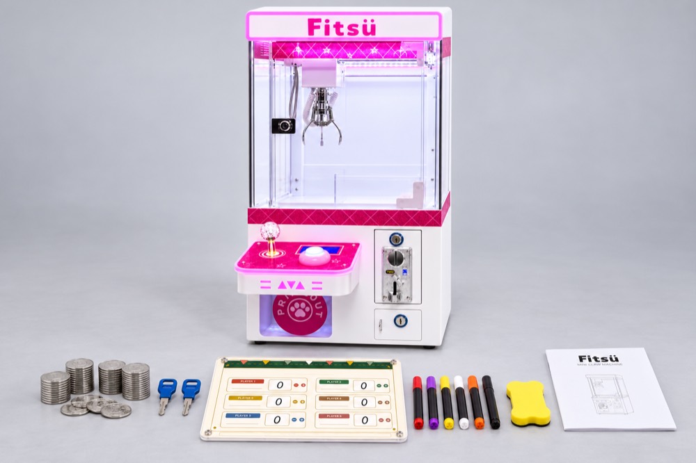 Claw machine with tokens, keys, scoreboard, markers and manual